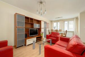 Телевизор и/или развлекательный центр в Gieldowa by Solarento