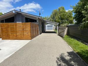 a driveway leading to a house with a garage at Palmy Hideaway - Dog Friendly in Palmerston North