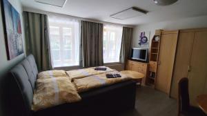 Postel nebo postele na pokoji v ubytování Altstadthaus Marille mit Innenhofterrasse + 20 fotografií