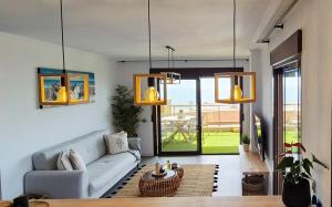 a living room with a couch and a table at Blue Amber-Los Arenales del Sol-Alicante in Arenales del Sol +53 photos