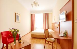 Una cama o camas en una habitación de Hotel Mozart