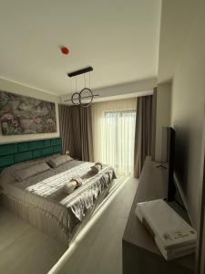 En eller flere senge i et værelse på Maribela Apartments