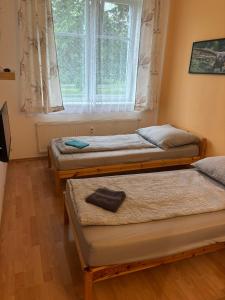 Posteľ alebo postele v izbe v ubytovaní Apartmány Topolová 909B velký