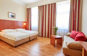 Llit o llits en una habitació de Hotel Mozart