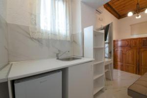 a kitchen with a sink and a counter top at Casa Tradizionale in Rhodes Town +17 photos