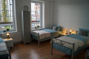 Ένα ή περισσότερα κρεβάτια σε δωμάτιο στο Förde Apartments Kiel +5 φωτογραφίες
