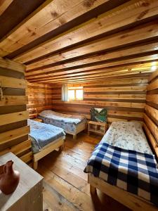 Postel nebo postele na pokoji v ubytování Guesthouse Javakhe