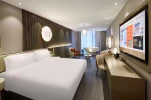 Voodi või voodid majutusasutuse Crystal Orange Hotel Shanghai Hongqiao Hub Railway Station toas