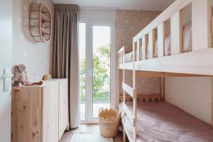 Postel nebo postele na pokoji v ubytování Casa Costeira Julianadorp