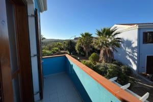 a view from the balcony of a house at 4 minuti dalla Spiaggia della Pelosa, Confortevole Appartamento con A-C in Stintino