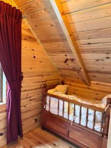 A bed or beds in a room at Nehir Bungalows
