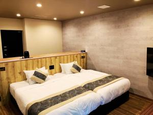 Postel nebo postele na pokoji v ubytování Livemax Resort Sanuki Shionoe Onsen + 37 fotografií
