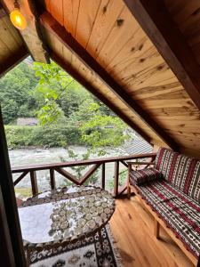 A balcony or terrace at Nehir Bungalows