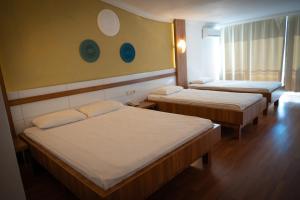 a hotel room with three beds and a window at Club Golf Hotel All Inclusive in Side +85 photos