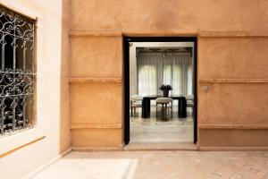 an open door into a dining room with a table at Marrakech Villa with Private Pool & Family-Friendly in Marrakesh