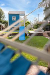 a playground with a blue bench in a park at Marrakech Villa with Private Pool & Family-Friendly in Marrakesh