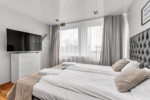 Ένα ή περισσότερα κρεβάτια σε δωμάτιο στο Midtown Hotel