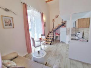 a living room with a couch and a table at Bianchi's flower in Cavtat