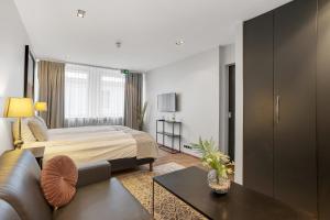Ένα ή περισσότερα κρεβάτια σε δωμάτιο στο Midtown Hotel