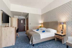 Postel nebo postele na pokoji v ubytování Spa & Wellness Hotel Diament Ustroń