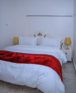Postel nebo postele na pokoji v ubytování Sinyati Suites Narok