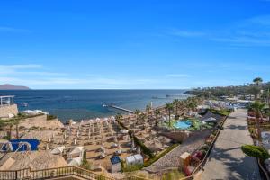 an aerial view of a beach with chairs and the ocean at Royal Savoy Sharm El Sheikh in Sharm El Sheikh