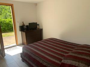 Postel nebo postele na pokoji v ubytování Gîte dans maison Quercynoise
