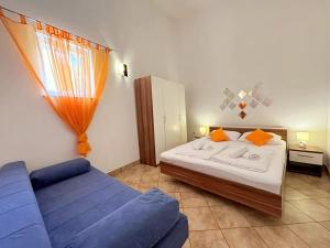 Posteľ alebo postele v izbe v ubytovaní Top Apartments