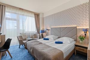 Postel nebo postele na pokoji v ubytování Spa & Wellness Hotel Diament Ustroń