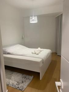 a bedroom with a bed with two towels on it at Vuelo Sobre Bečići in Bečići +28 photos