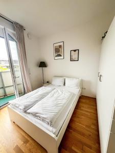 Ένα ή περισσότερα κρεβάτια σε δωμάτιο στο Messe Munich Apartment