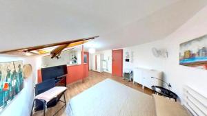 a living room with red and white walls at Mansarda loftorino in Turin