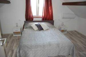 Katil atau katil-katil dalam bilik di Holiday Home Luca