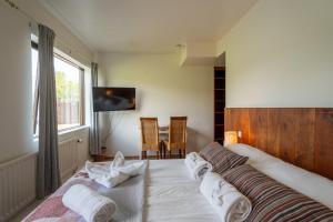 En eller flere senger på et rom på Hotel Skógá by EJ Hotels