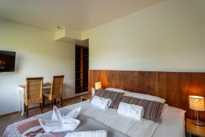 En eller flere senger på et rom på Hotel Skógá by EJ Hotels
