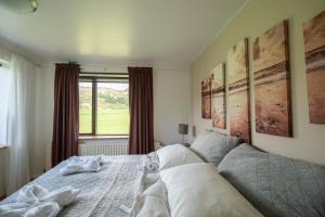 En eller flere senger på et rom på Hotel Skógá by EJ Hotels