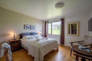 En eller flere senger på et rom på Hotel Skógá by EJ Hotels