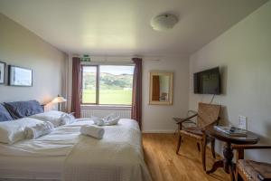 En eller flere senger på et rom på Hotel Skógá by EJ Hotels