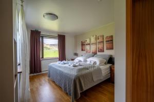 En eller flere senger på et rom på Hotel Skógá by EJ Hotels