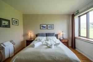 En eller flere senger på et rom på Hotel Skógá by EJ Hotels