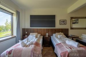 En eller flere senger på et rom på Hotel Skógá by EJ Hotels