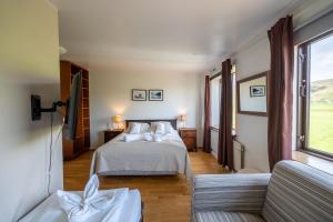 En eller flere senger på et rom på Hotel Skógá by EJ Hotels