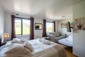 En eller flere senger på et rom på Hotel Skógá by EJ Hotels