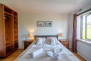En eller flere senger på et rom på Hotel Skógá by EJ Hotels