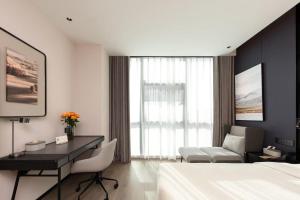 Postel nebo postele na pokoji v ubytování Atour Hotel Suzhou Industrial Park Fengting Avenue