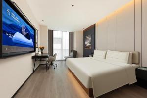 Postel nebo postele na pokoji v ubytování Atour Hotel Suzhou Industrial Park Fengting Avenue
