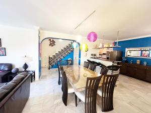 a kitchen and dining room with a table and chairs at Villa Aurelia Sea views Heatable Pool - Billiard Ping-pong Fooball table - Beach & All at 500 m in La Cala de Mijas