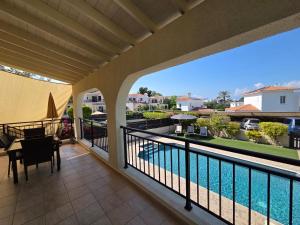 a balcony with a view of a swimming pool at Marinea 2 in Paphos