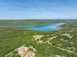 an aerial view of a resort and a lake at House Trget in Trget