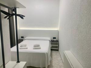 Postel nebo postele na pokoji v ubytování Hotel DL Urban